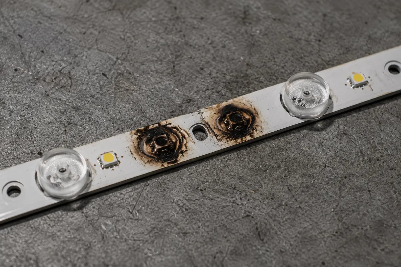 Burnt-out TV backlight LED strip that must be replaced.