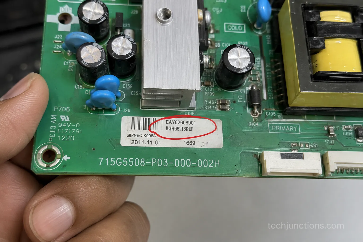LG TV power board with the EAY part number circled on its sticker