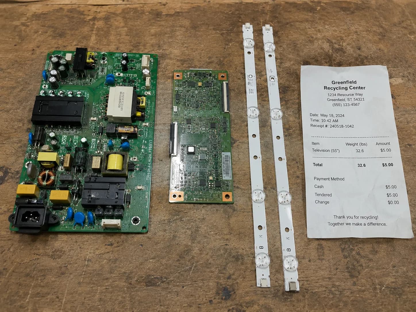 Salvaged TV boards and backlight strips before recycling.