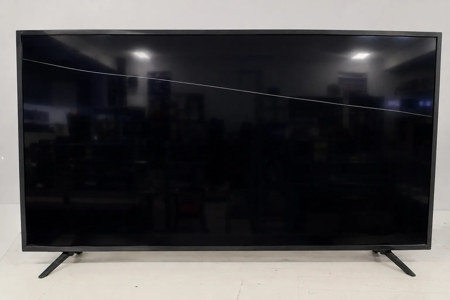 40-inch flat-screen TV with a hairline crack across the upper screen, illustrating a damaged panel presented for Best Buy TV repair inspection and diagnosis.
