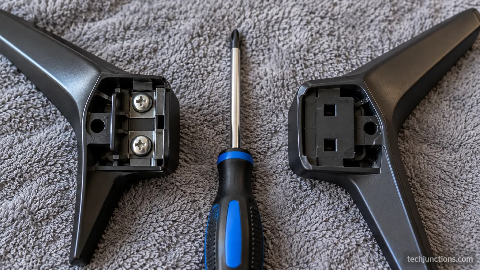 Close-up comparing an LG TV screw-attached leg base with a clip-in leg base that has square slots and no screws.