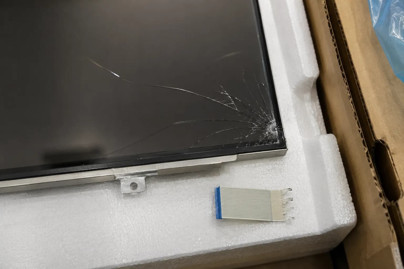 replacement tv panel cracked on arrival with a torn ribbon cable