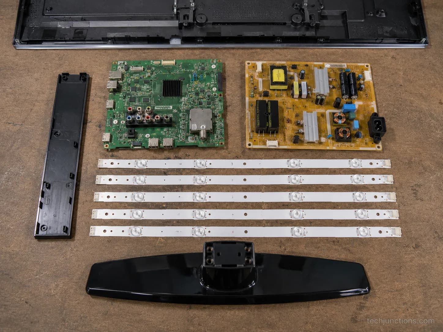 salvaged TV boards and LED backlight strips laid out.