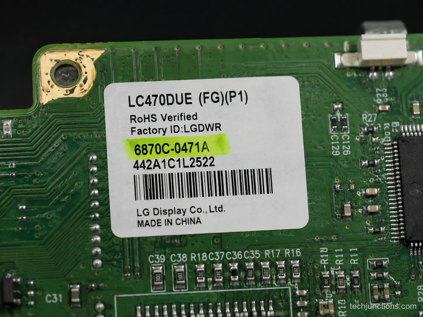 Close-up of a TV control-board sticker with the part number highlighted for ordering the correct replacement.